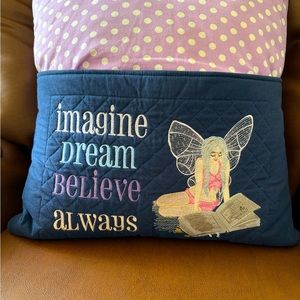 Fairy embroidered reading pillow. Navy blue and purple polka dot.